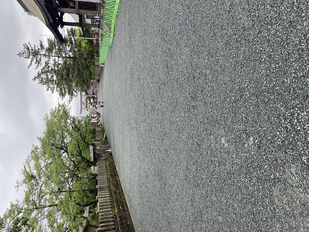 Row of torii gates along the path at Aso Shrine