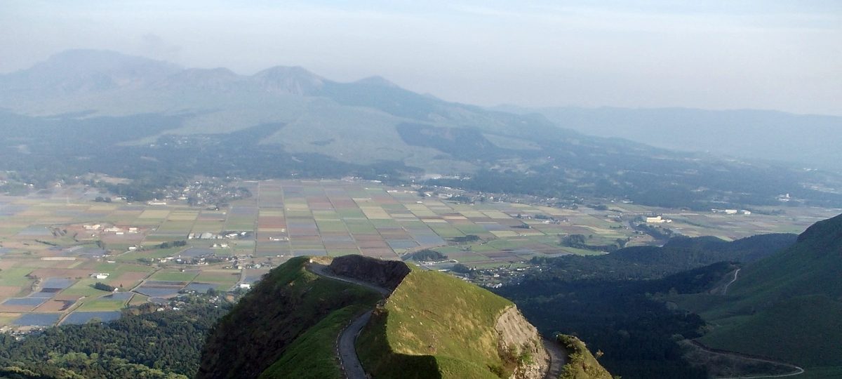 The Tenku-no-michi sky road stretching through the green Aso caldera