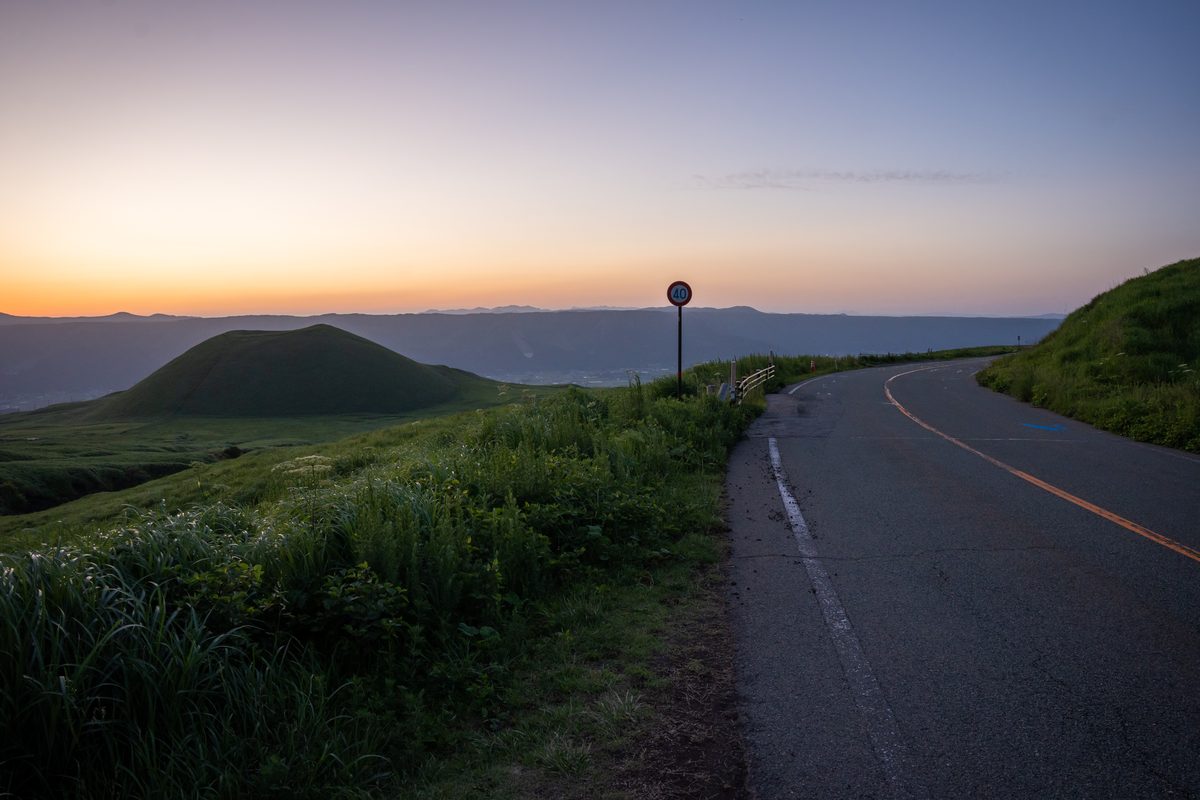 Golden sunset over the Aso caldera with mountains silhouetted
