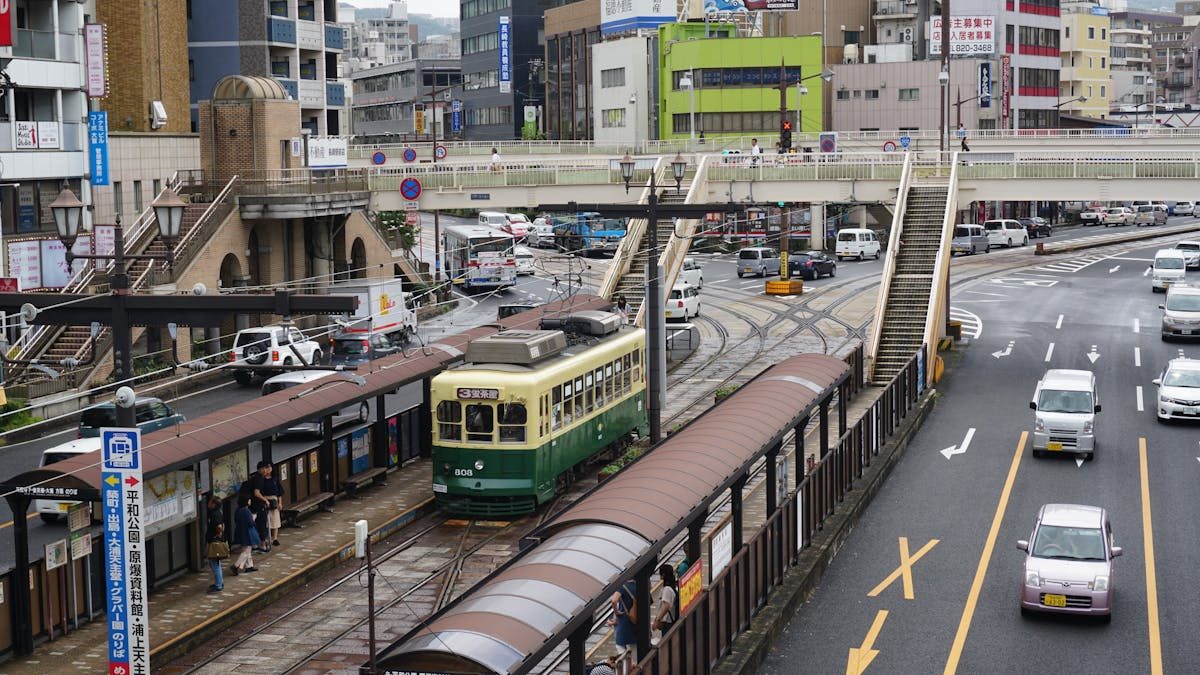 Nagasaki city street with tram and urban traffic