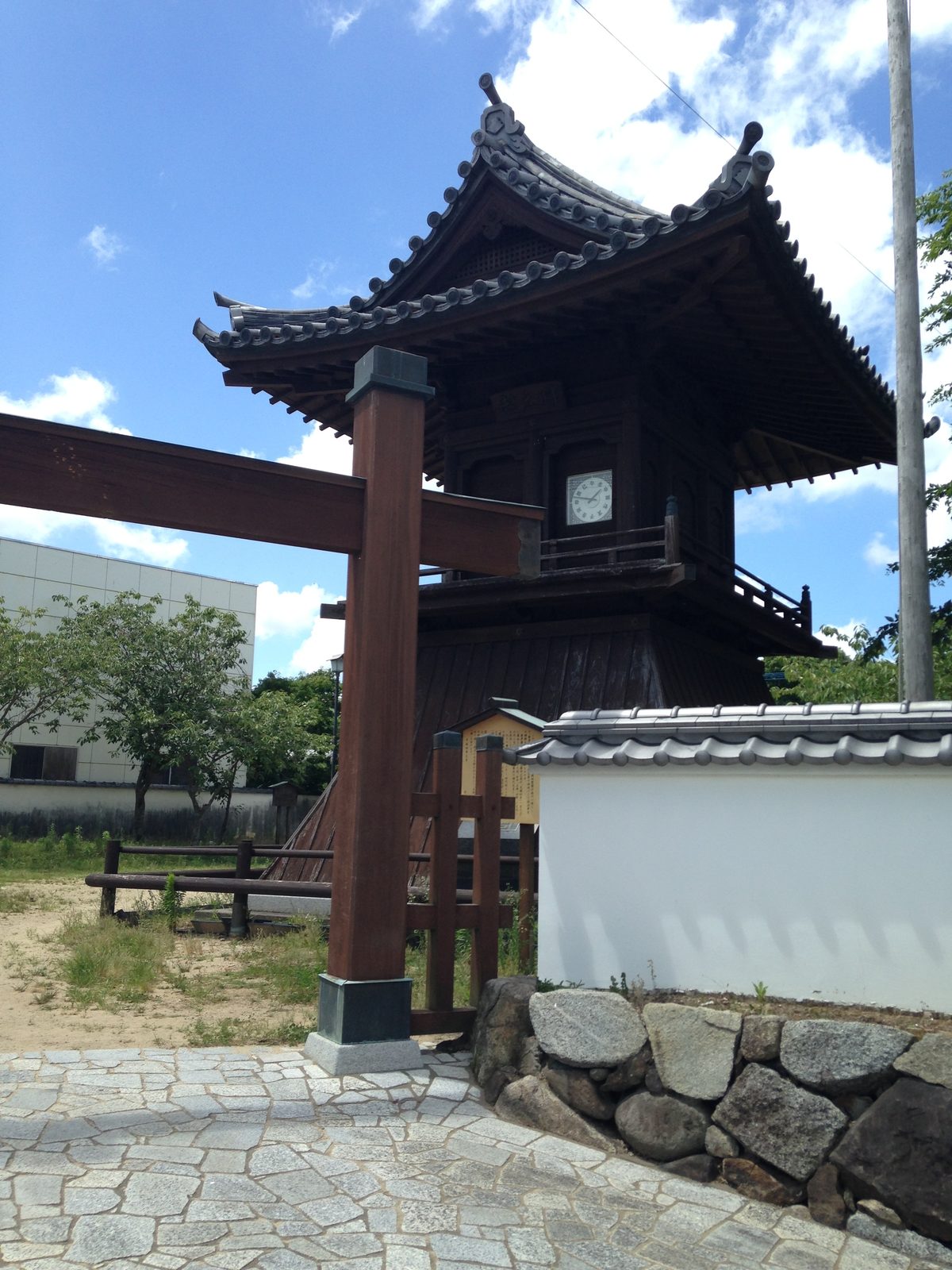 Clock tower turret reflected in the moat at Karatsu Castle