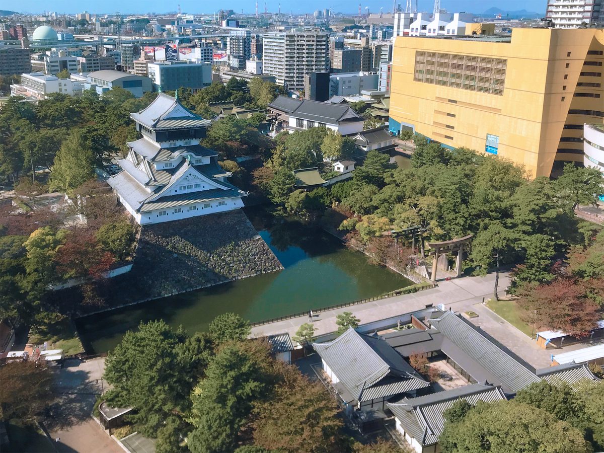 Traditional Japanese garden at Kokura Castle with pond and manicured trees