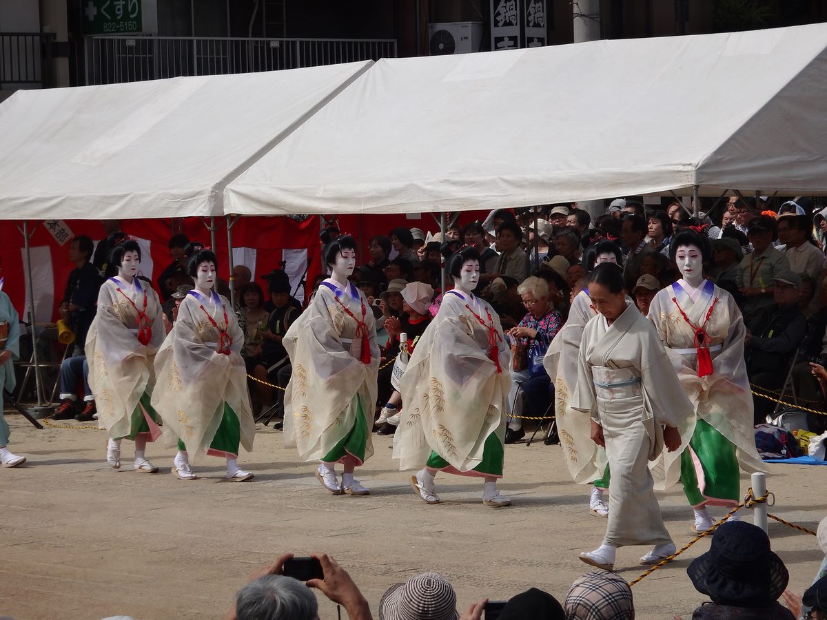 Overhead view of Kunchi festival at Suwa Shrine showing performers and audience