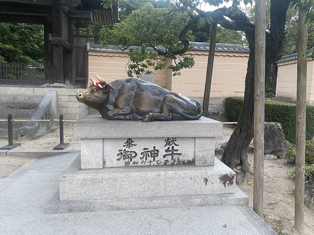 Bronze bull statue at Dazaifu Tenmangu, rubbed smooth by visitors seeking good luck in exams
