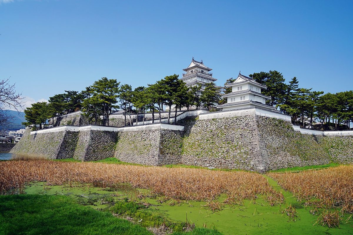 Shimabara Castle with its white walls and surrounding moat