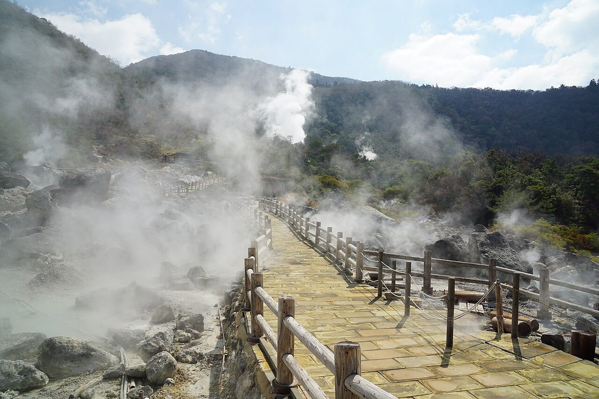 Walking path through the Unzen Jigoku hell springs with steam billowing